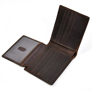 Detail view of genuine leather wallet showing multiple card slots and a clear ID window