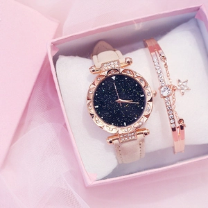 Starry sky dial watch and rose gold star charm bracelet set in a pink luxury gift box