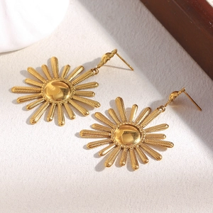 Detailed close-up of gold sunflower stud earrings made from 18K plated stainless steel