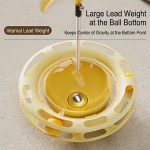 Yellow pet tumbler cat toy with multi-layer track balls and a feather wand attachment