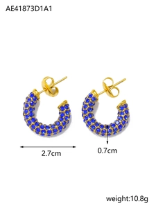 Detail view of 2.7cm gold C-shaped earrings with dense blue crystals and sizing info