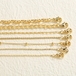 Golden basic chain necklace collection with lobster clasp in various styles and textures