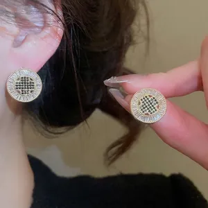 French vintage round stud earrings with gold plating, black stones and clear zircons