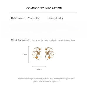 Detail showing gold alloy butterfly flower earrings with 6.2cm and 3.6cm size dimensions