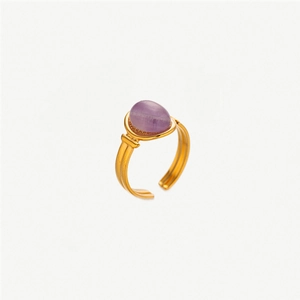 Macro shot of vintage gold adjustable ring with oval purple natural stone inlay