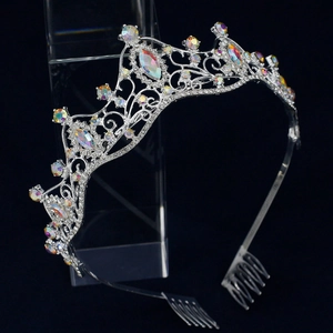 Detail of silver bridal crown with iridescent rhinestones and integrated hair combs