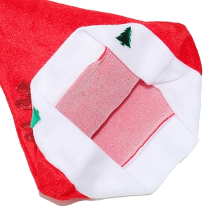 Detailed close-up of the plush fabric and interior non-woven lining of a Christmas hat