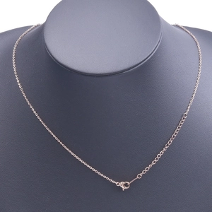 Detail of rose gold stainless steel link chain with lobster clasp on a grey display bust