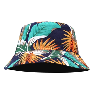 Reversible wide-brim bucket hat featuring a navy tropical floral palm leaf print