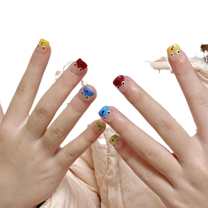 Colorful funny bug press-on nails for kids with cute cartoon eye designs on vibrant colors