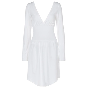 Detail of white long sleeve V-neck mini dress with waist cinch and elegant pleated skirt
