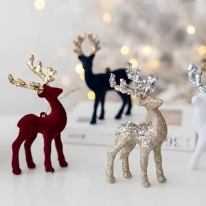 Christmas reindeer ornaments set in flocking and glitter finishes with hanging ropes