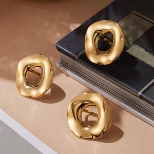 Irregular hollow oval open ring with a polished gold finish and modern minimalist style