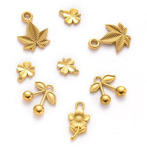 Detailed view of gold stainless steel charms including maple leaf, clover and cherry