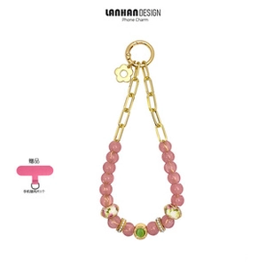 Detail of pink beaded phone chain with gold metal links and flower charm attachment