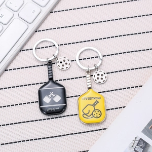 Zinc alloy pickleball racket keychains in black and yellow with ball charms