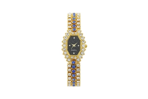 Close-up of gold quartz watch featuring blue and clear rhinestones on a black octagon dial