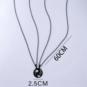 Detail view of yin yang sun and moon couple necklace showing 2.5cm pendant size