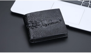 Macro detail of black crocodile pattern leather wallet on professional office desk