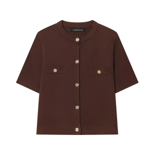 Close-up of gold embossed buttons and pocket detail on brown short sleeve knit cardigan