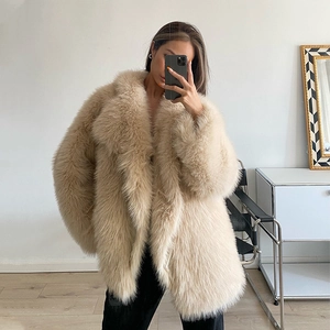 Women's warm cream faux fur coat with long sleeves and loose fit in midi length