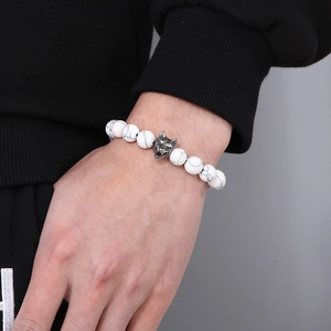 Men's white turquoise beaded bracelet with vintage alloy wolf head on wrist