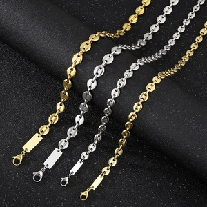 Detail of titanium steel pig nose link chains in gold and silver with square tags
