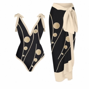 Detail of black V-neck swimsuit and matching polka dot sarong with bow shoulder straps