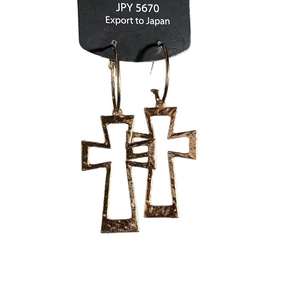 Golden hammered cross earrings with round hoops on black display card with white background