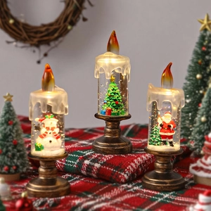 Trois bougies boules à neige LED de Noël avec figurines de Père Noël et de bonhomme de neige