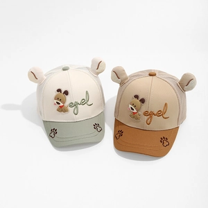 Close-up of baby baseball caps with cute cartoon dog embroidery and 3D ears