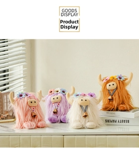 Detail of four colorful Highland cow plush toys with floral accents and golden bells