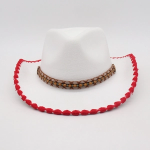 White cowboy hat with red stitching and colorful beaded band on a neutral background