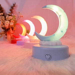 Detail of crescent moon night lights showing red, purple, warm yellow and blue lighting