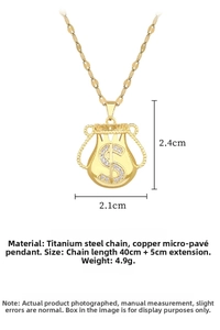 Detail showing gold lucky money bag pendant necklace with sparkling micro-pave crystals