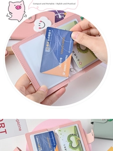 Close-up of pink leather card holder with cloud smile patch and transparent PVC slots