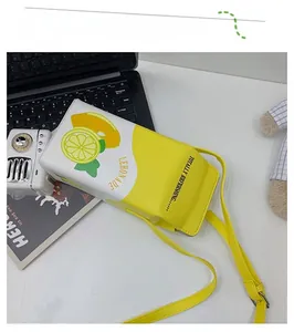 Detailed view of lemon theme milk carton crossbody bag with lemonade prints and strap