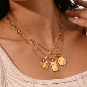 Triple layer 18K gold plated stainless steel necklace with starburst zircon charms