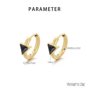Detailed view of 18K gold plated triangle geometric earrings with black faceted glass