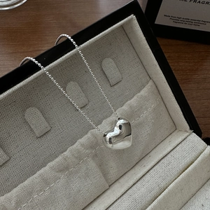 Minimalist S925 sterling silver heart pendant necklace on soft jewelry box lining