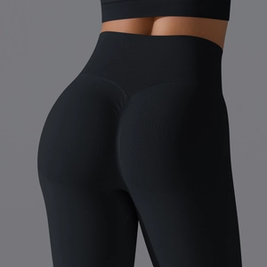 Detail of high waisted seamless yoga leggings with scrunch butt lifting texture in black