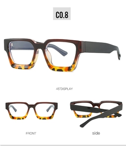 Detail view of square black and tortoiseshell glasses frames with clear lenses