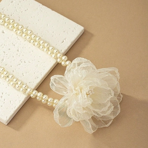 Elegant double-layered faux pearl choker necklace with a large 3D cream fabric flower
