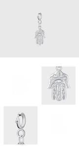 Detailed macro view of 925 sterling silver Hamsa hand pendant with floral engravings