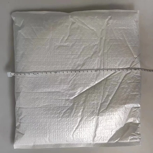 Measurement of 30cm wide white ghost wooden sign decoration inside a bubble mailer