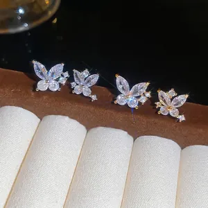 Elegant gold plated silver butterfly stud earrings with sparkling zircon gemstones