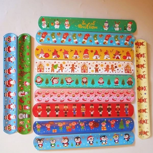 Set of 12 colorful Christmas slap bracelets featuring Santa and reindeer party designs