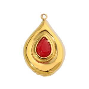 Close-up of gold stainless steel teardrop pendant with red gemstone inlay detail