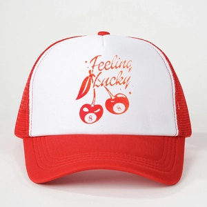 Detail of red and white trucker hat featuring Feeling Lucky cherry 8-ball print design
