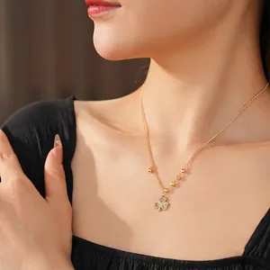 Elegant gold beaded chain necklace with textured shamrock clover pendant for women